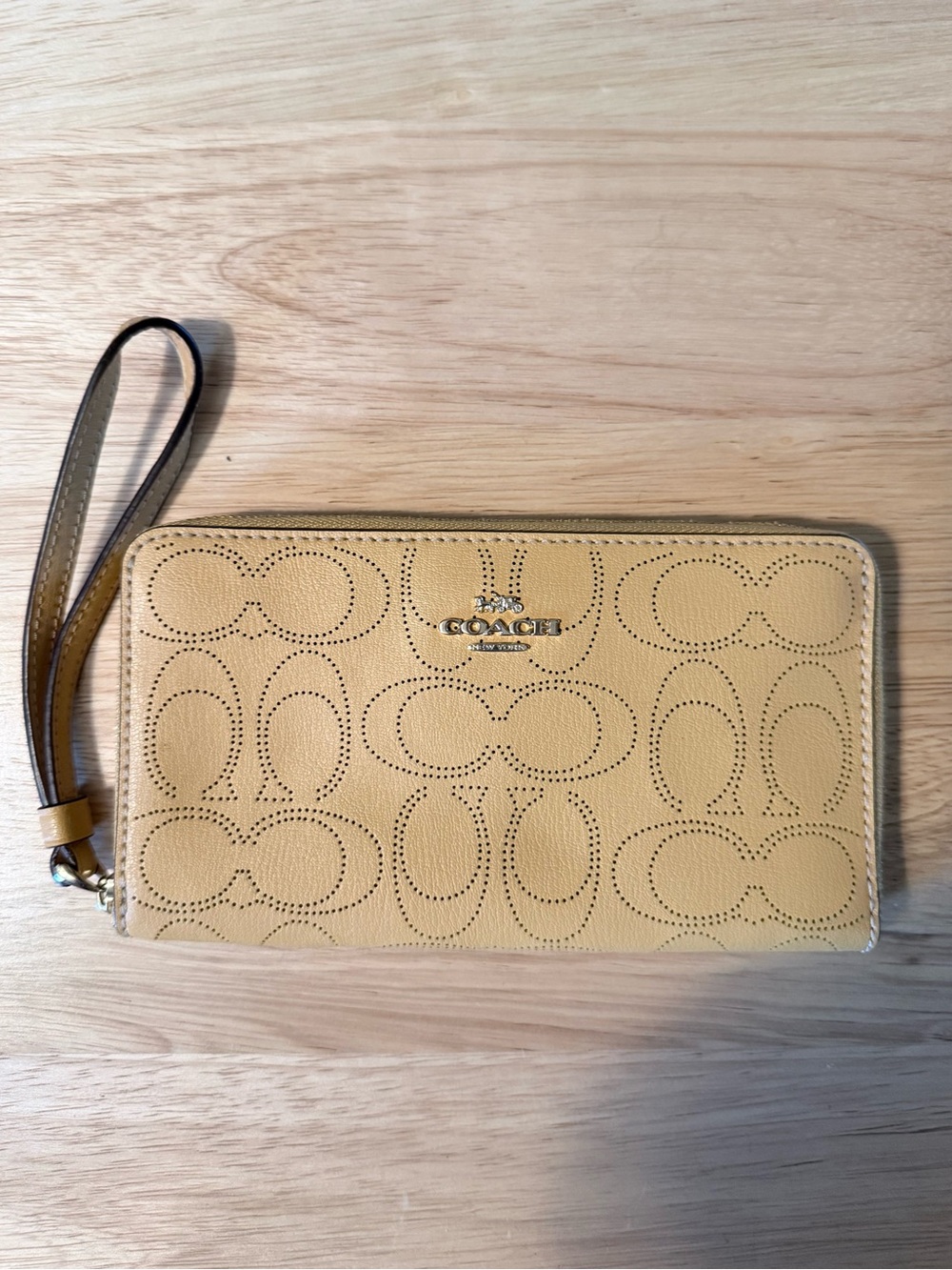 COACH Perforated Signature Zip-Around Wristlet in Mustard Yellow